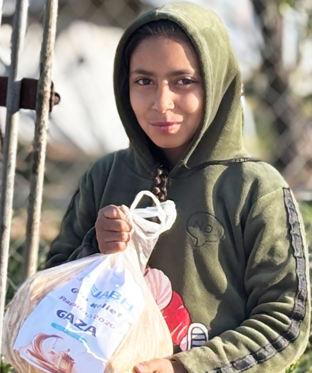 A girl holding a food parcel
